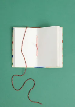 Gudrun Sjödén Anteckningsbok "Divya" i tygbeklätt papper